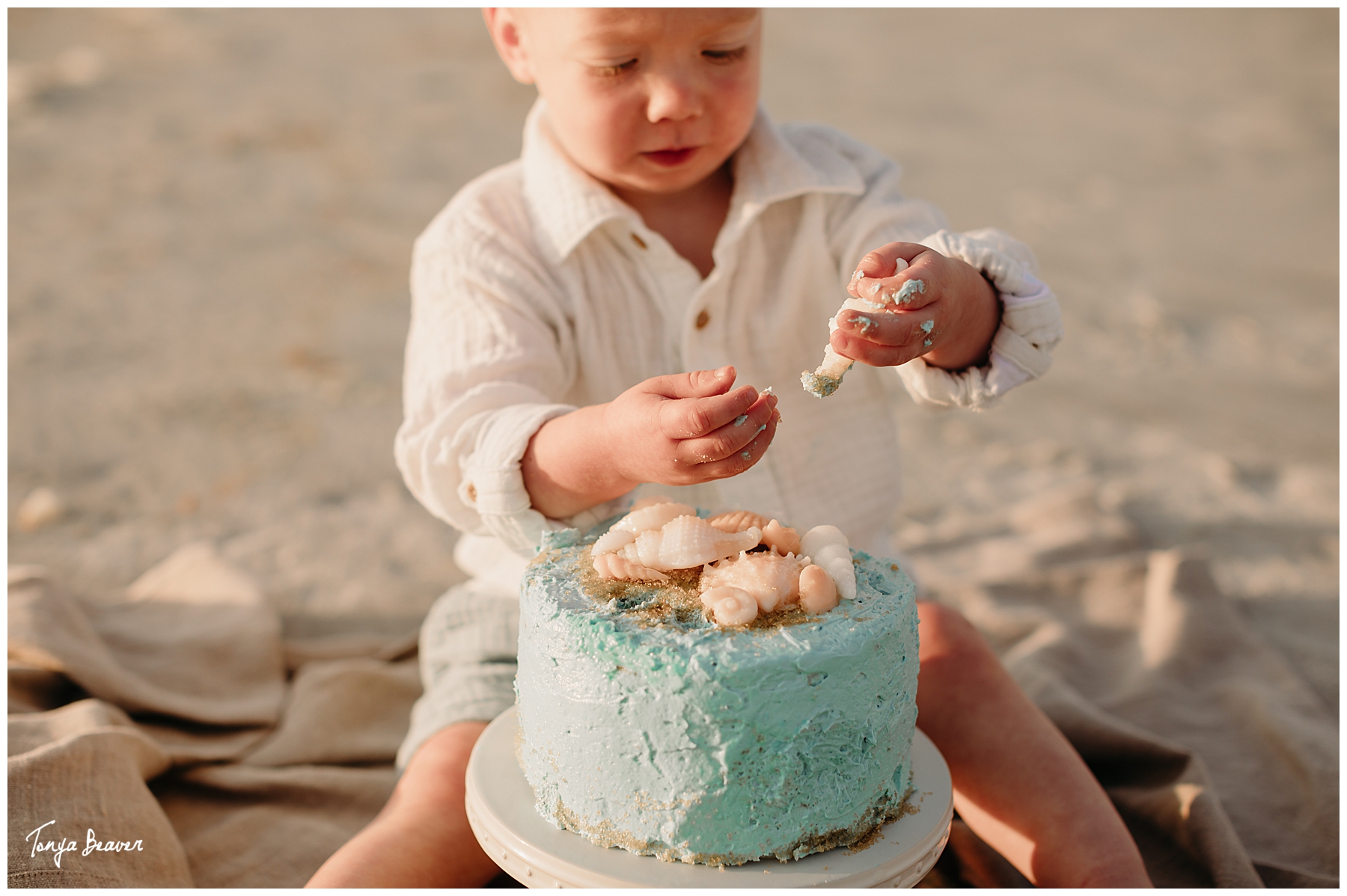 TWO YEAR BIRTHDAY CAKE SMASH ON BEACH; TWO YEAR BIRTHDAY CAKE SMASH ON BEACH PHOTOGRAPHY; TWO YEAR BIRTHDAY CAKE SMASH PHOTOS; TWO YEAR BIRTHDAY CAKE SMASH PHOTOGRAPHER; TWO YEAR BIRTHDAY CAKE SMASH PICTURES;  Milestone Photography; Smash Cake Photography; JACKSONVILLE CAKE SMASH PHOTOGRAPHY; JACKSONVILLE CAKE SMASH PHOTOGRAPHER; JACKSONVILLE CAKE SMASH PHOTOS; JACKSONVILLE CAKE SMASH PICTURES;