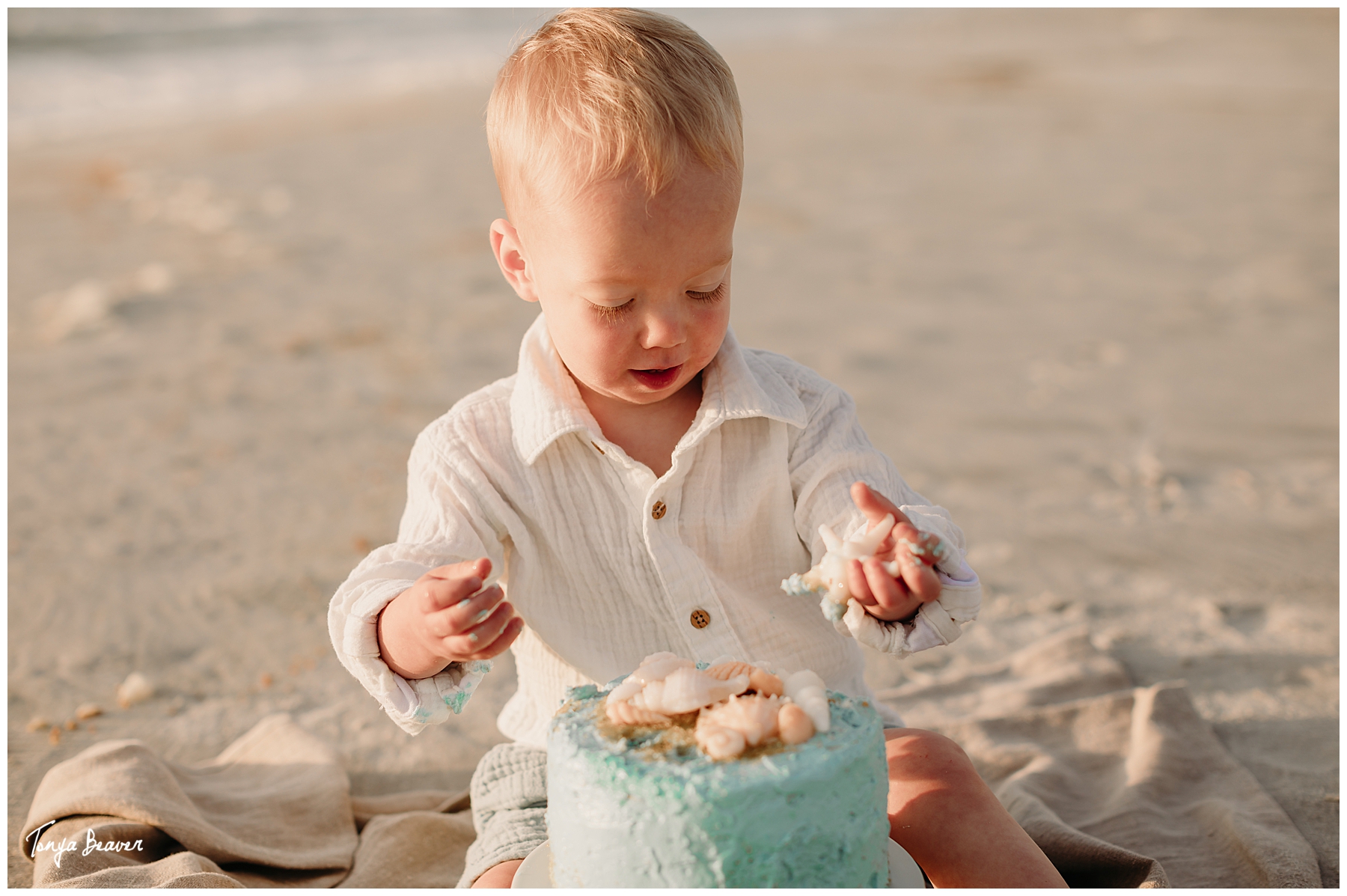 TWO YEAR BIRTHDAY CAKE SMASH ON BEACH; TWO YEAR BIRTHDAY CAKE SMASH ON BEACH PHOTOGRAPHY; TWO YEAR BIRTHDAY CAKE SMASH PHOTOS; TWO YEAR BIRTHDAY CAKE SMASH PHOTOGRAPHER; TWO YEAR BIRTHDAY CAKE SMASH PICTURES;  Milestone Photography; Smash Cake Photography; JACKSONVILLE CAKE SMASH PHOTOGRAPHY; JACKSONVILLE CAKE SMASH PHOTOGRAPHER; JACKSONVILLE CAKE SMASH PHOTOS; JACKSONVILLE CAKE SMASH PICTURES;