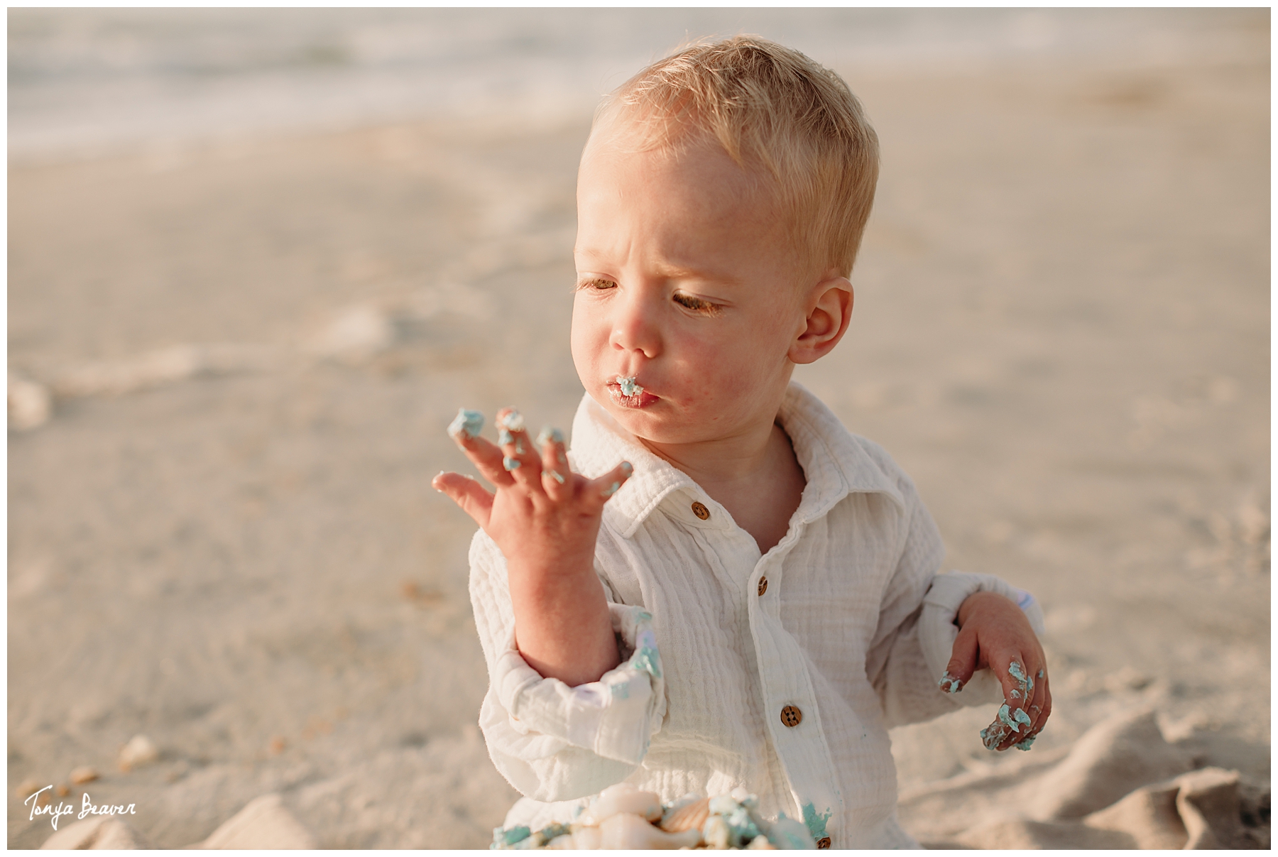 TWO YEAR BIRTHDAY CAKE SMASH ON BEACH; TWO YEAR BIRTHDAY CAKE SMASH ON BEACH PHOTOGRAPHY; TWO YEAR BIRTHDAY CAKE SMASH PHOTOS; TWO YEAR BIRTHDAY CAKE SMASH PHOTOGRAPHER; TWO YEAR BIRTHDAY CAKE SMASH PICTURES;  Milestone Photography; Smash Cake Photography; JACKSONVILLE CAKE SMASH PHOTOGRAPHY; JACKSONVILLE CAKE SMASH PHOTOGRAPHER; JACKSONVILLE CAKE SMASH PHOTOS; JACKSONVILLE CAKE SMASH PICTURES;